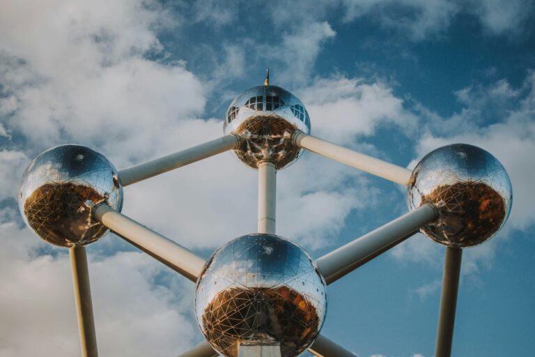 Iconic spherical structure Atomium in Brussels against a blue sky.